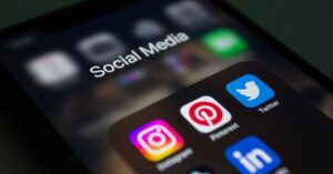 A smartphone screen displaying popular social media applications like Instagram and Twitter.