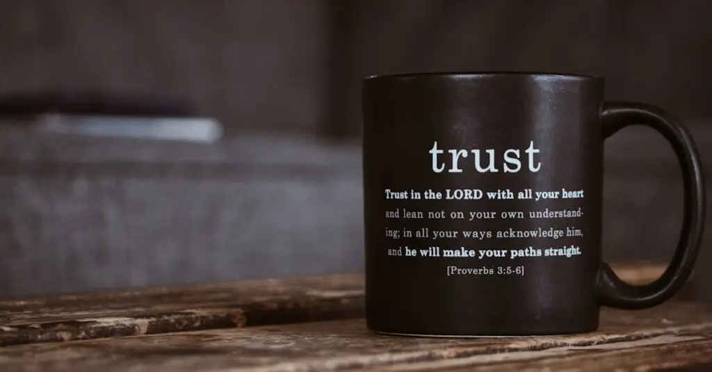 Black ceramic mug with white religious text from Holy Bible placed on shabby wooden surface in room